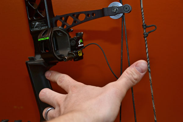 A bowhunter indicates brace height as the distance between the deepest part of the grip and the bow's string.